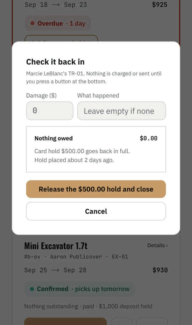 Check it back in: nothing owed, and one button to release the $500.00 hold